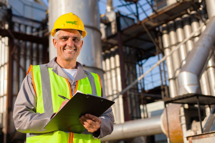 20660919 – happy middle aged oil industry worker in refinery plant